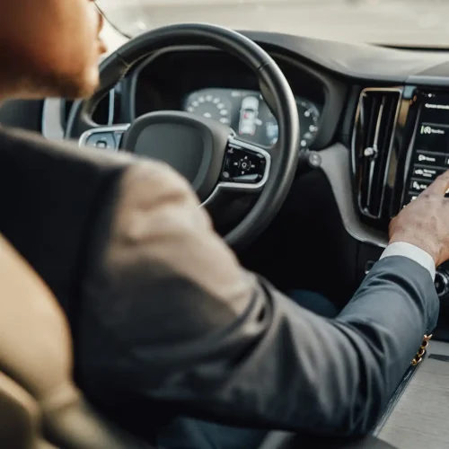 black-businessman-inside-car-using-car-panel-2023-11-27-04-53-56-utc (1)